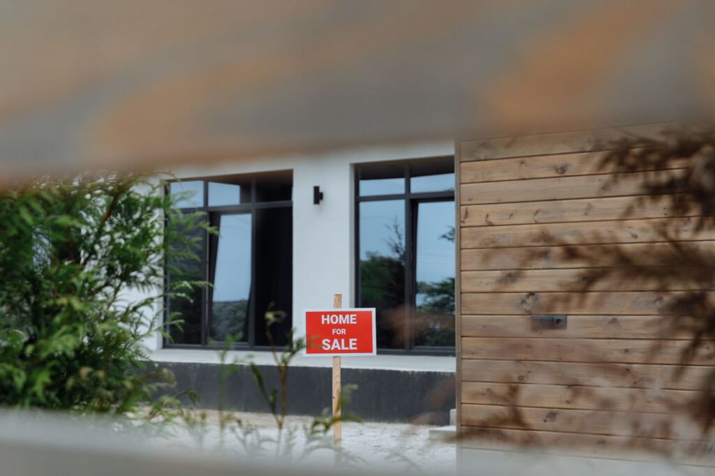 Real estate professional guiding buyer through property purchase documentation process